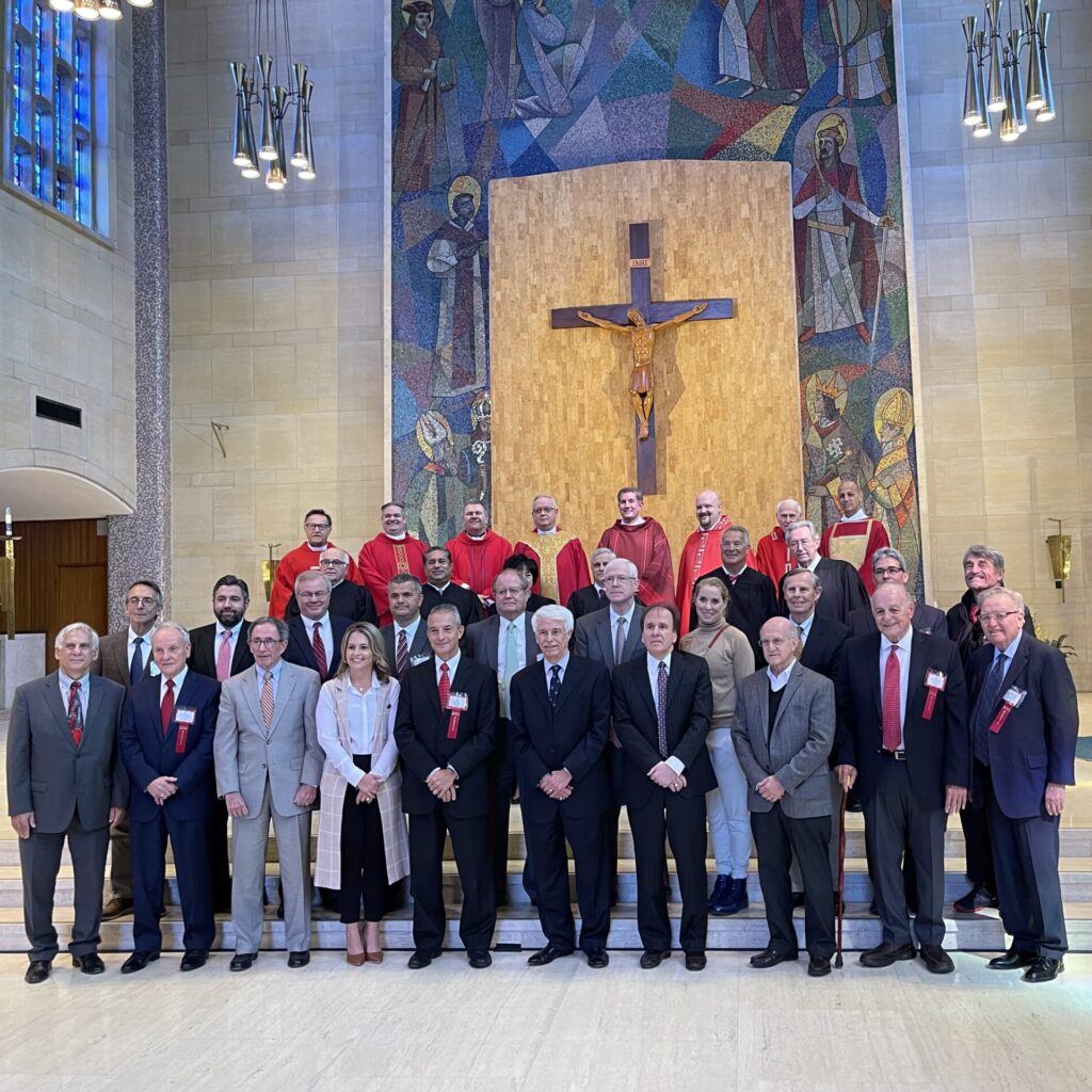 Members of the Legal & Judicial professions gather and smile in St. Columba Cathedral, Youngstown, Ohio for the Annual Red Mass