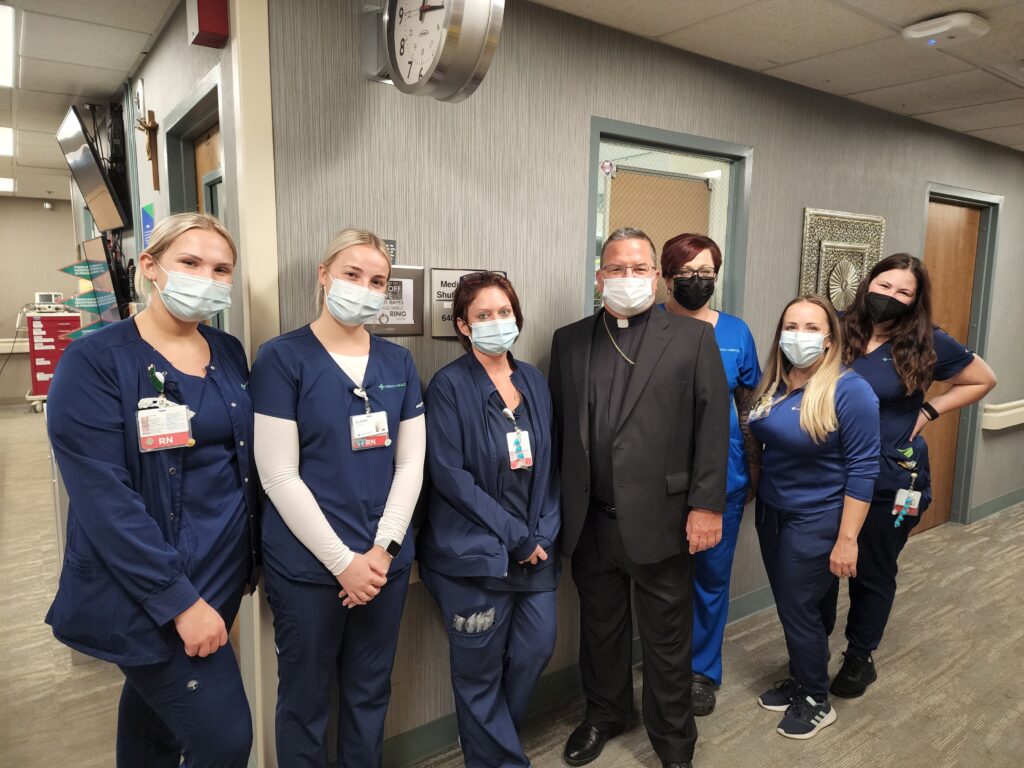 Bishop Bonnar with employees at St. Elizabeth Youngstown Hospital