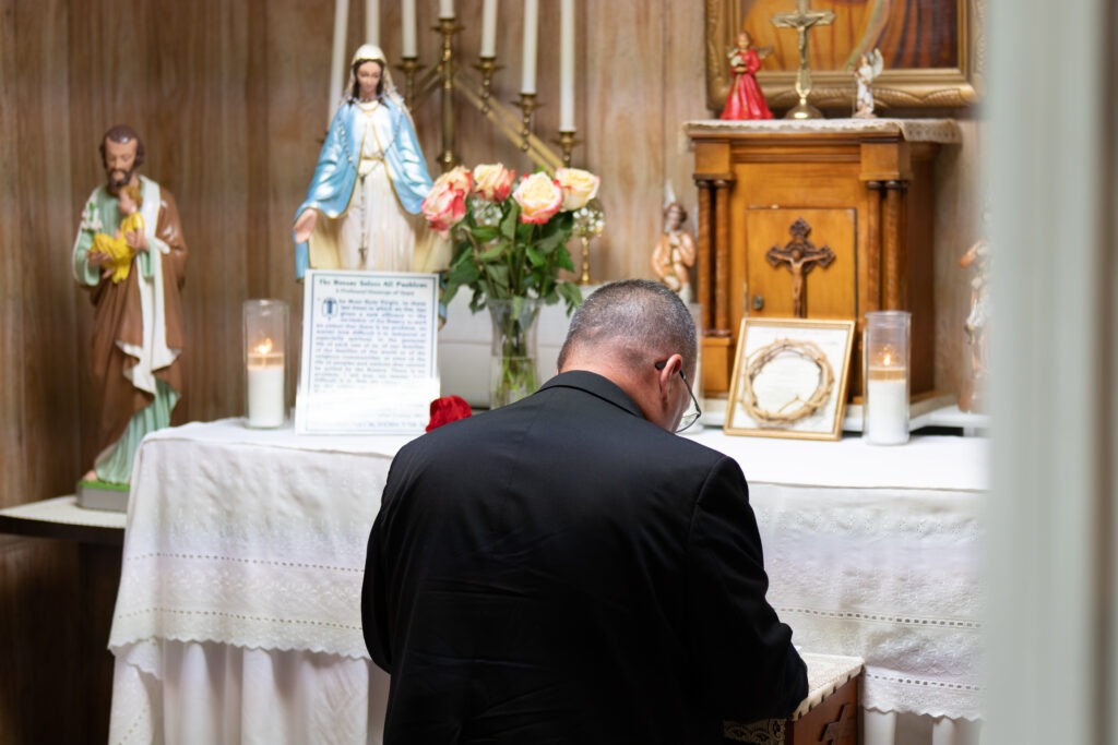 Bishop David Bonnar prays at the Grotto of the Sacred Heart and Little Flower at the Rhoda Wise House in Canton, Ohio on July 7, 2023. Photo by Brian Keith.