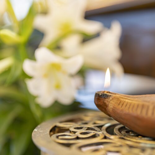 Lilies and oil lamp at the celebration of Religious Jubilees on April 13, 2024 at Blessed Sacrament Parish in Warren, Ohio