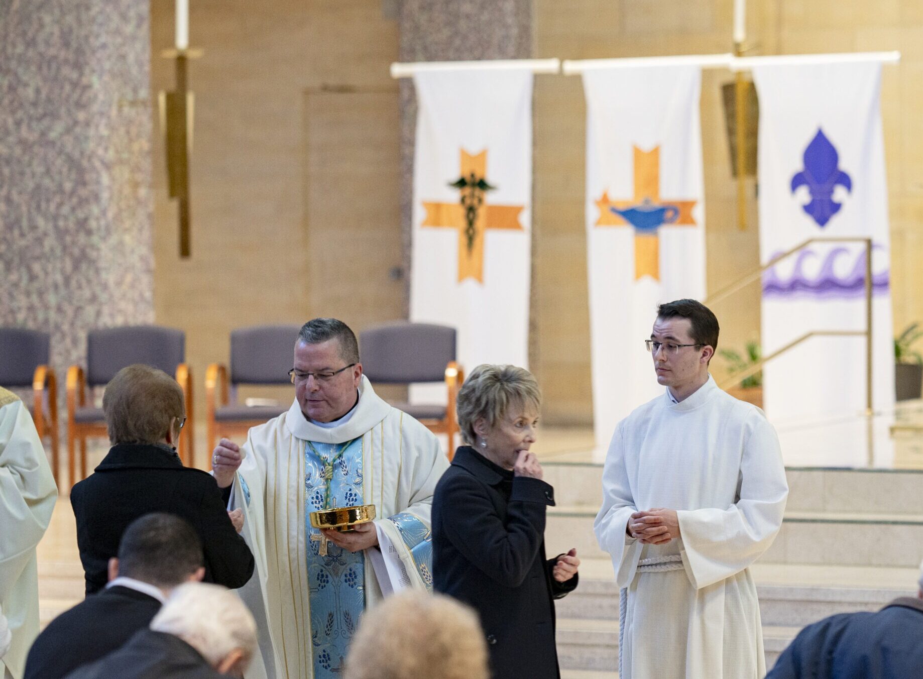 Bishop Bonnar distributes communion at the White Mass at St. Columba Cathedral, Youngstown on February 11, 2024